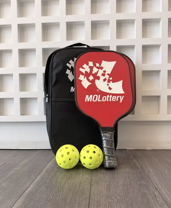 Red corporate logo paddle with a branded backpack and printed balls